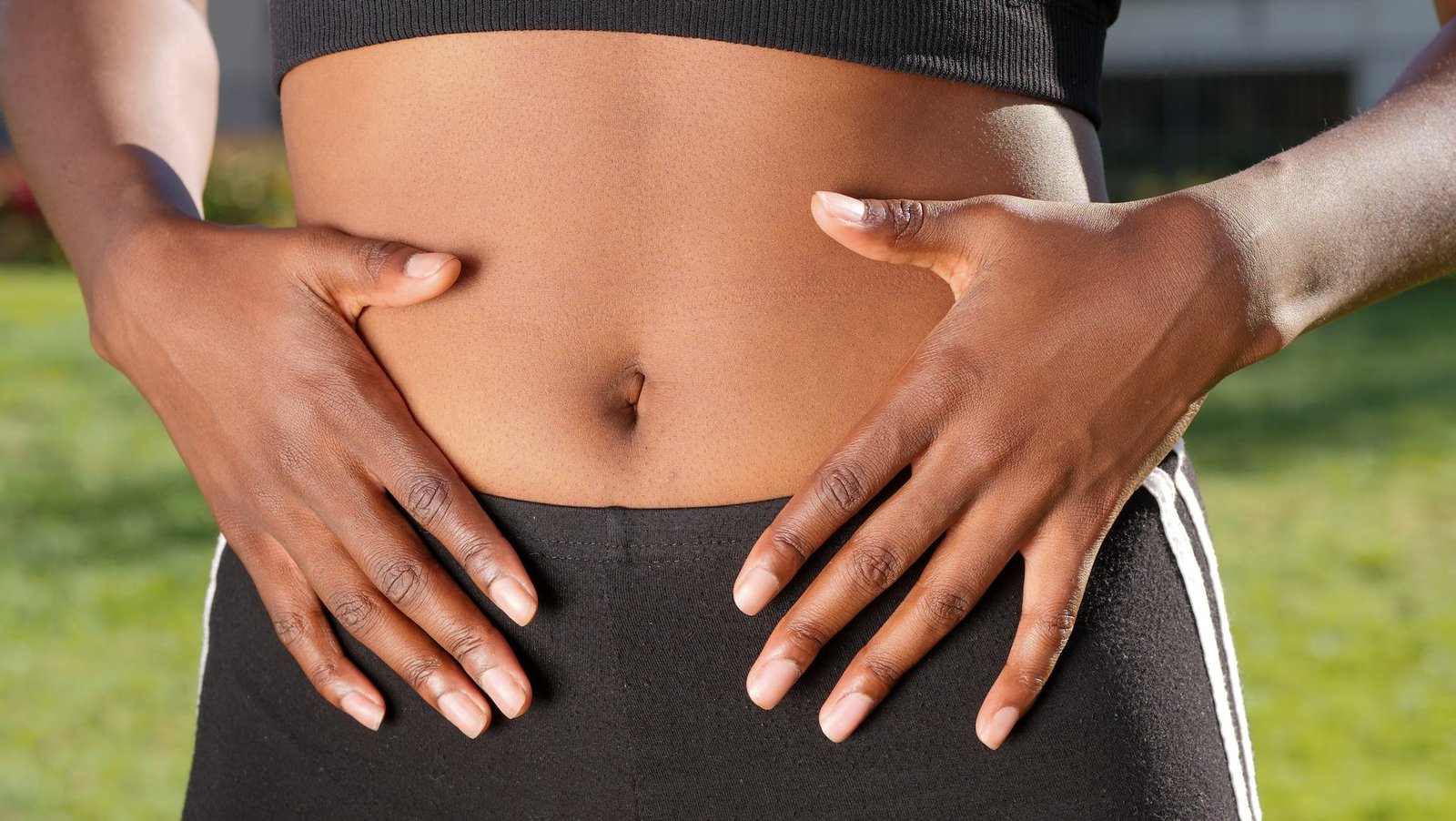 A Person Touching Her Belly - digestive health