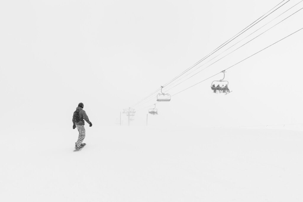 Man Walking in the Snow at Daytime in winter