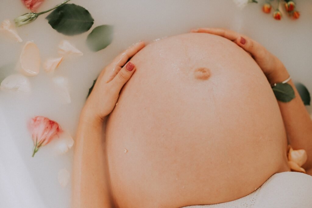 Pregnant mom Sitting on Bathtub