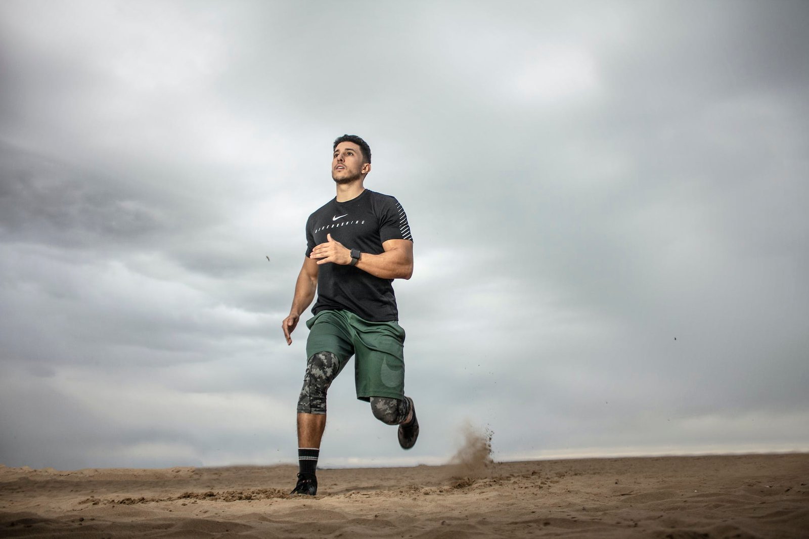 Man Running on Sand Field 