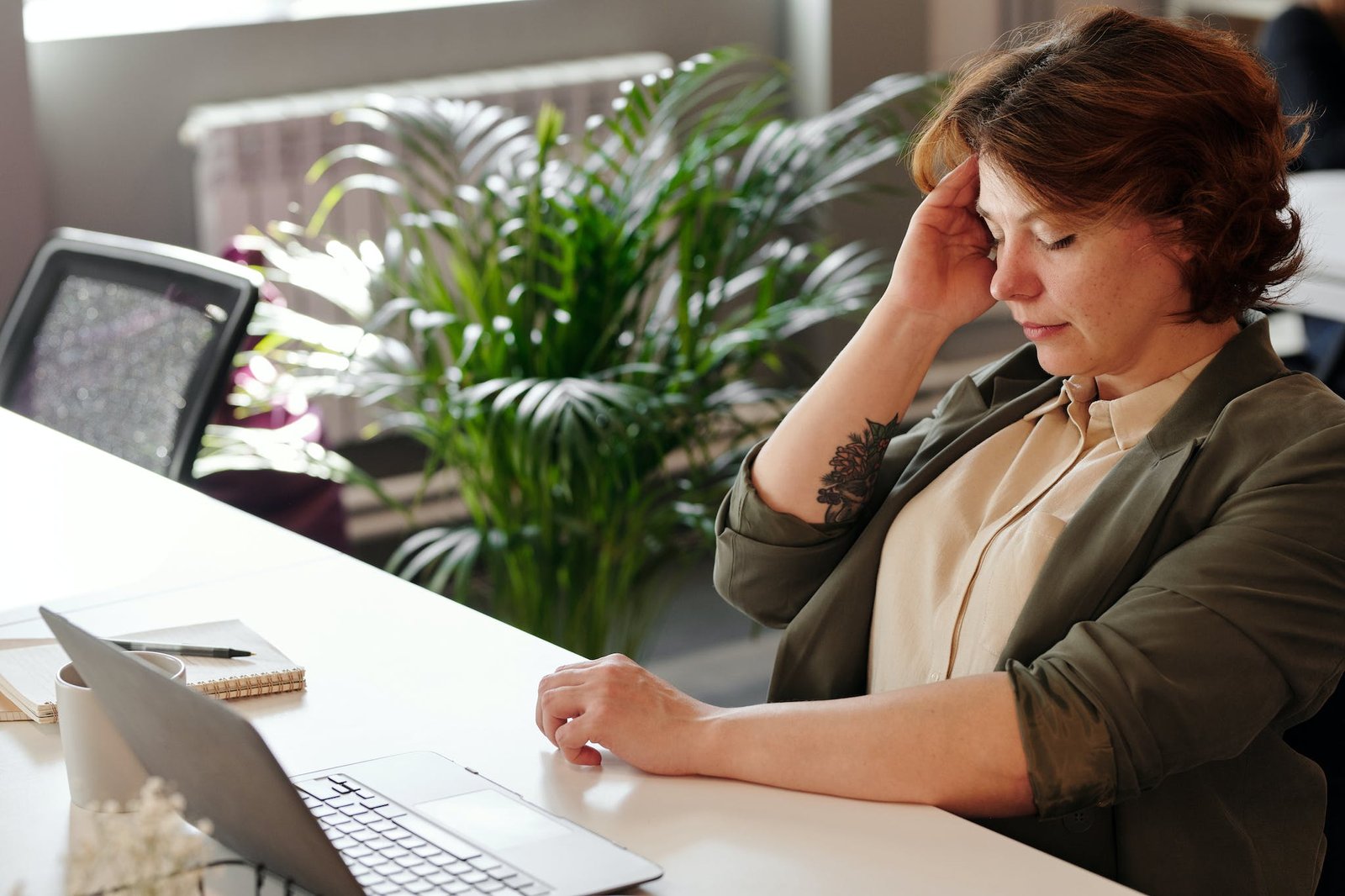 Photo of Woman Holding Her Head with headache